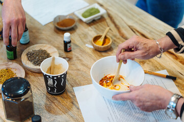 Natural soap workshop. Mixing ingredients to make soap