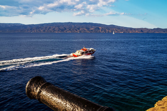 Motorboat swimming on  high speed in Mediterranean Sea - view from Hydra Greek island