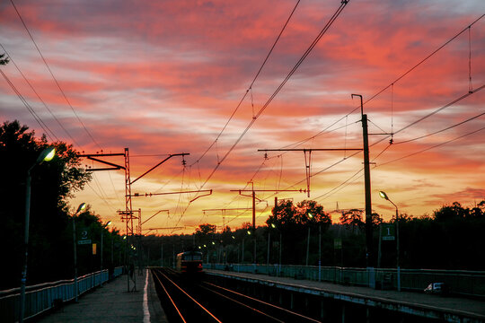 Amazingpink-yellow sunset on  station  (electrical train (maybe D2 or D1 or D3 or D4)  in Moscow Oblast