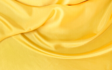 yellow gold satin texture that is white silver fabric luxurious shiny that is abstract silk cloth...