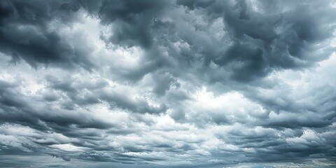 Dramatic grey sky over the ocean with a boat sailing on the water