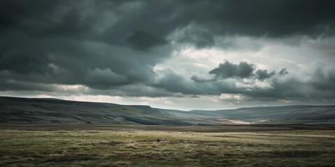 A vast expanse of land stretches out under a cloudy sky, creating a striking contrast