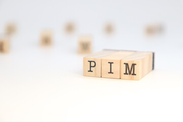 PIM acronym (Product Information Management) written on wooden cubes
