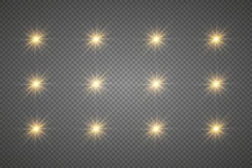 Obraz na płótnie Canvas Golden sparkling stars, twinkling and flashing lights. Collection of various lighting effects. On a transparent background.