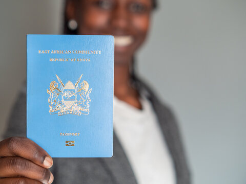 Businesswoman holding her kenyan east african passport