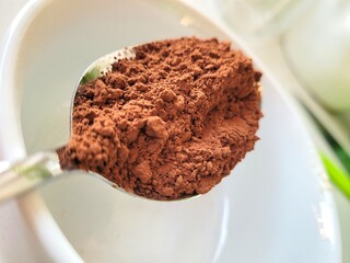 Little pile of cocoa powder for bitter taste.