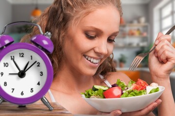 Intermittent fasting health young woman eat salad