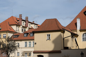 Obraz premium Typical European architecture. Old houses in Prague with tiled roofs.