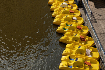 Empty yellow pedal boat on the river for tourists' entertainment in Prague during the summer...