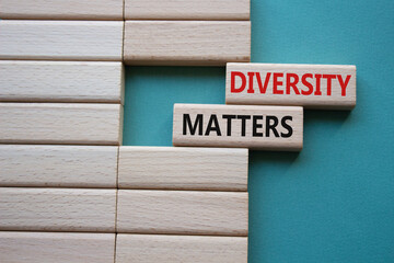 Diversity matters symbol. Wooden blocks with words Diversity matters. Beautiful grey green background. Business and Diversity matters concept. Copy space.