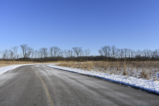An image of a winding pathway during Wintertime in rural America