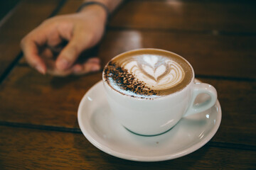 cup of coffee in hand