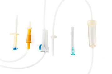 Disposable device for transfusion of blood, blood substitutes and infusion solutions on isolated white background. Close-up