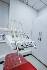 New empty dental office with dental chair for dental treatment. Tools for dental treatment