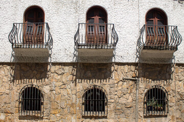 Traveling through Venezuela, traditional architecture of the tascas in Caracas. Facade with colonial windows