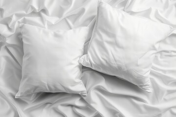 Blank soft pillows on white bed