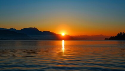 Obraz premium Sun Setting Over Lake With Mountains