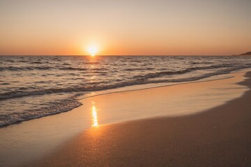 Sunset on the beach. Paradise beach. Tropical paradise, white sand, beach, palm trees and clear...