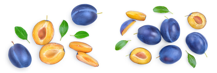 fresh blue plum and half with leaves isolated on white background. Top view. Flat lay