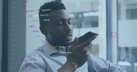 Image of data processing over african american businessman talking on smartphone