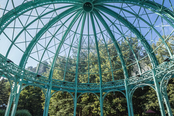 Tourists in pavilion with mineral water fountain spring in Borjomi resort town, Samtskhe-Javakheti region, Georgia