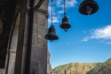 Bells of Church of the Dormition in Vardzia cave monastery site on a slope of Erusheti Mountain,...