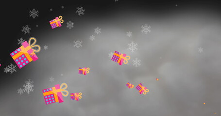 Fototapeta na wymiar Image of christmas presents and snow falling