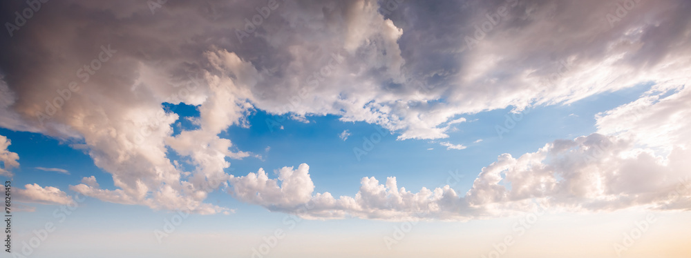 Wall mural Picturesque sky background with white fluffy clouds.