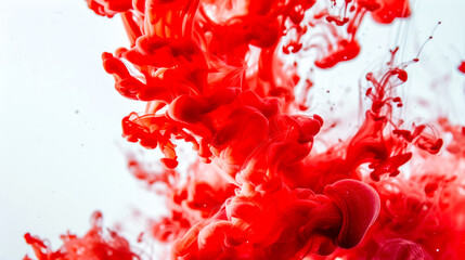 Vibrant red ink swirl in water