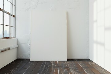 blank canvas leaning against wall in white room, dark woodern floors, window open, natural lighting