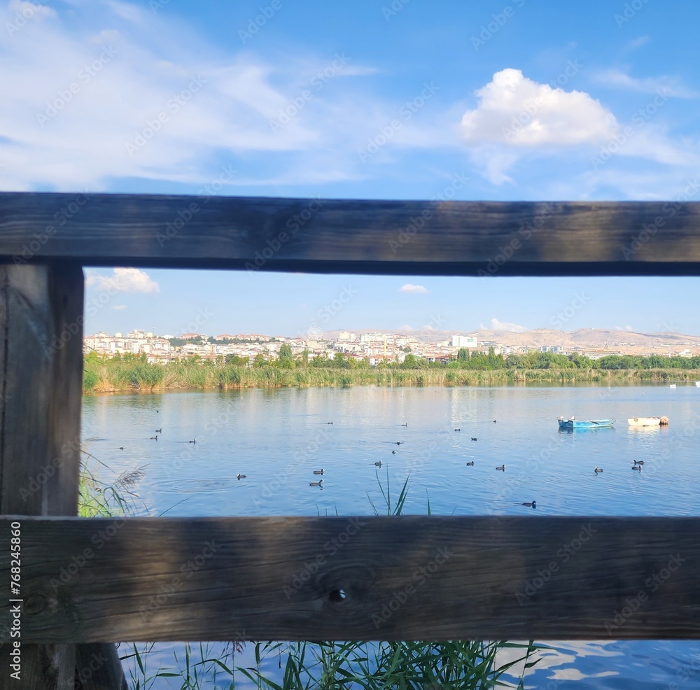 Wall mural view of the lake and the boat