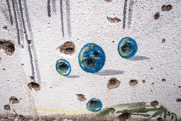 Street art on abandoned Ljubljanska Bank, destroyed during Bosnian War in Mostar, Bosnia and...