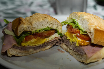 French bread sandwich with tomato and lettuce, egg and meat called typical lomito from Cordoba Argentina
