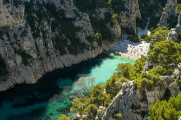 Calanque d'En-vau remote beach with turquoise water surrounded by cliffs, beautiful summer swimming and relaxing spot, aerial view, Calanques National Park, Provence, France