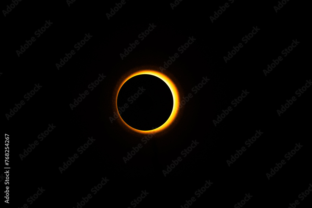 Wall mural eclipse re construction in a studio using a bright flashlight and a round cap with a bit of atmosphe