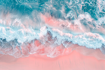 Aerial view of waves crashing on a pink beach in the early morning.