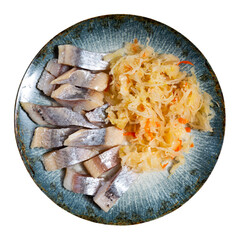 Tasty slices herring fish with pickled cabbage, served on plate. Isolated over white background
