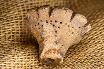 The Dyakov type weight is an archaeological clay artifact from the Early Iron Age. Central Russia