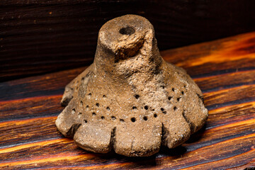 The Dyakov type weight is an archaeological clay artifact from the Early Iron Age. Central Russia