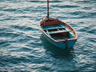 Small boat floating in the water
