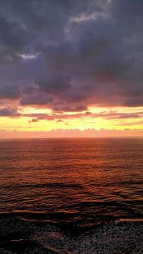 Drone vertical hyperlapse showing beautiful sunsets with ocean at the pacific coast from Costa Rica