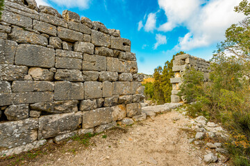 Fototapeta na wymiar Termessos ancient city the amphitheatre. Termessos is one of Antalya -Turkey's most outstanding archaeological sites. Despite the long siege, Alexander the Great could not capture the ancient city.