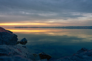 evening dusk in lake Balaton Siofok at sunset with rocks