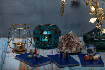 An intimate tarot reading session arrangement featuring vibrant crystals, tarot cards, and a geode...