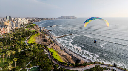Paragliders in Miraflores, Lima, flies peacefully over the Miraflores boardwalk. It is possible to...