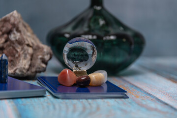 An intimate tarot reading session arrangement featuring vibrant crystals, tarot cards, and a geode...