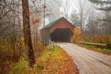 Covered Bridge No 23 in New Hampshire. It is on a Gravel winding road snaking through a forest of autumn colors in near Cornish, NH