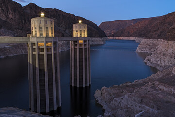 Hoover Dam intake towers and Lake Meade reservoir shown at dusk. Recent image taken in mid-March, 2024.