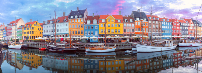 Panorama of Nyhavn with colorful facades of old houses and ships in Old Town of Copenhagen, Denmark. - 768279097