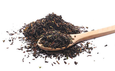 Heap Darjeeling Tea dried tea leaves in wooden spoon isolated on white, top view